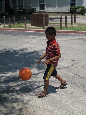 Refugee kid playing soccer
